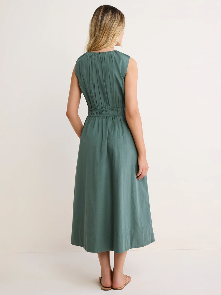 Sage green sleeveless midi dress, back view. Features gathered neckline and shirred elastic waist with a flowing skirt.