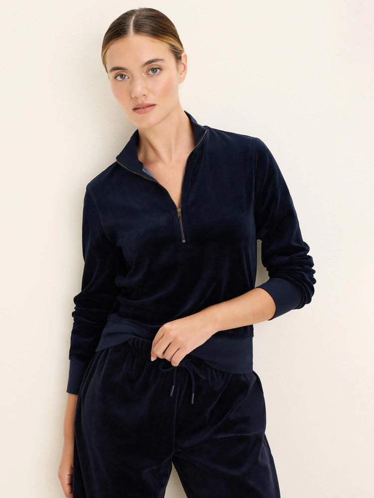 Navy velour half-zip pullover with a gold-tone zipper, stand collar, and ribbed cuffs and hem.