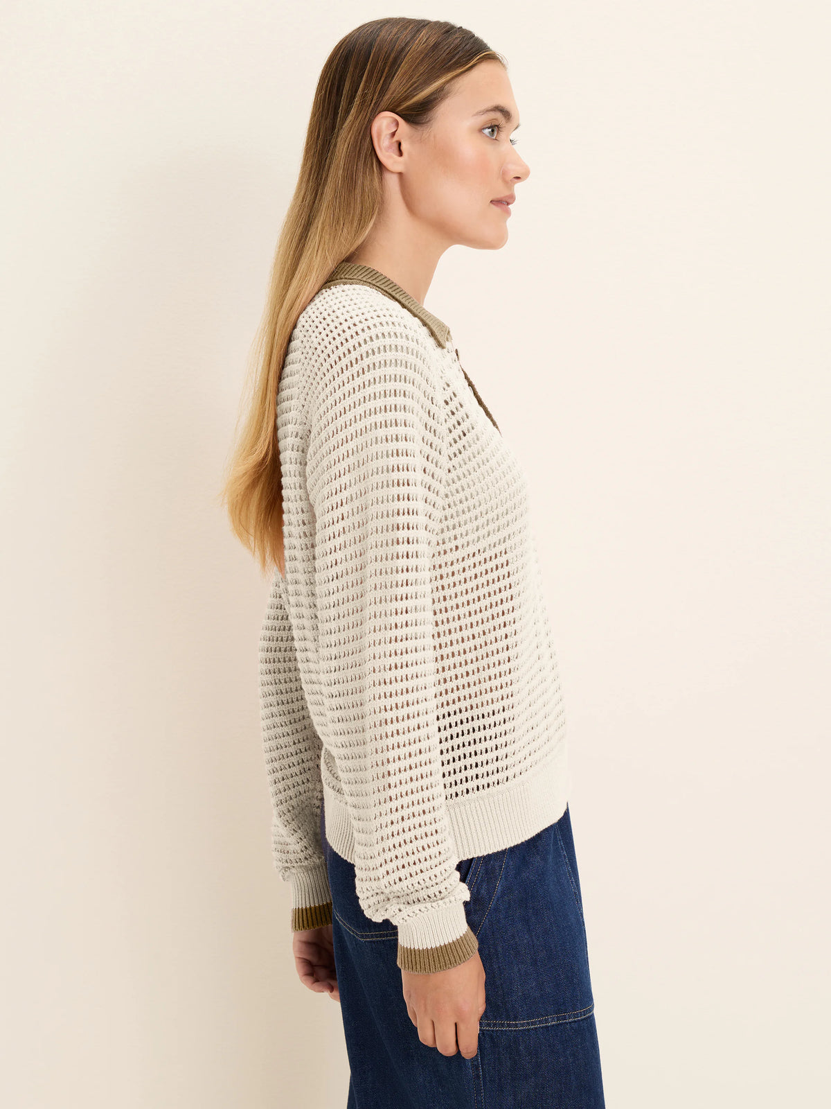 Off-white mesh knit long-sleeve polo sweater with an olive green collar and cuff trim.