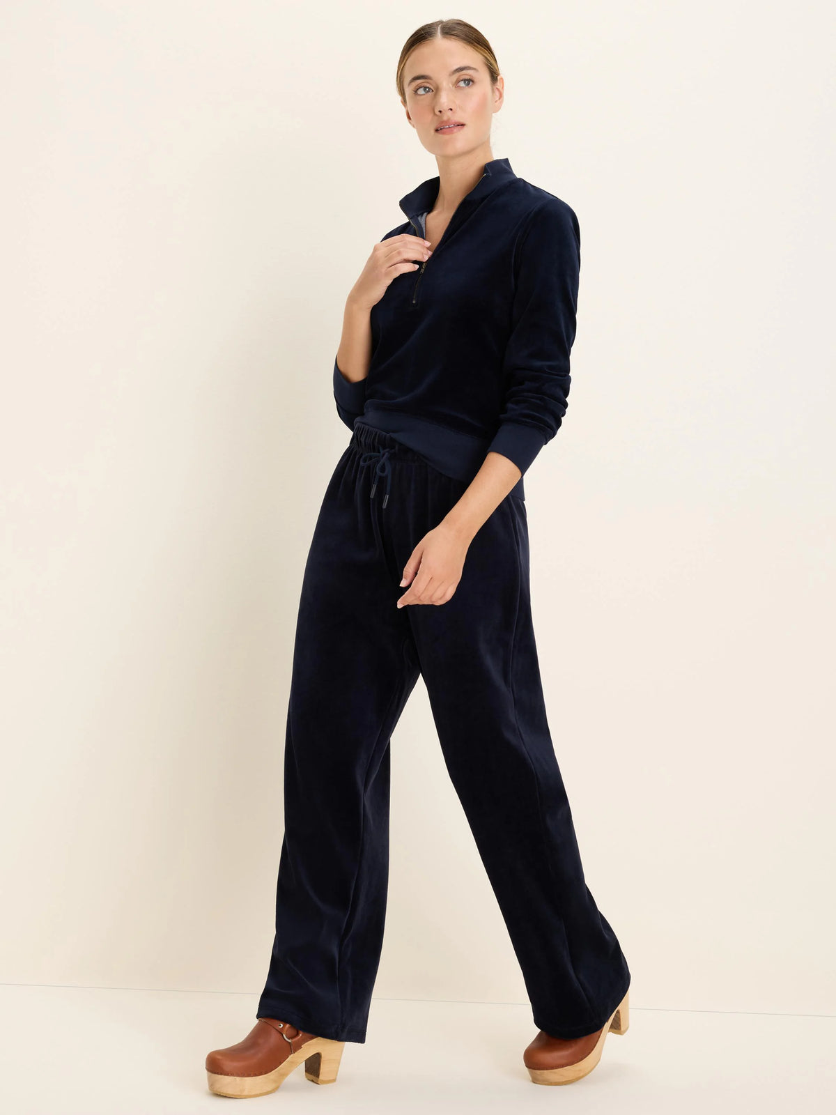 Navy velour wide-leg pants with a visible drawstring waist.