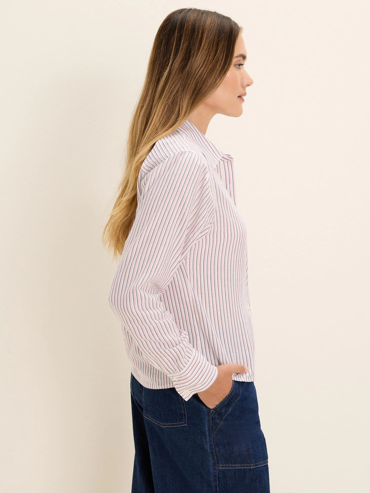 Off-white striped shirt with thin vertical pink and dark gray stripes. Long-sleeved, collared.