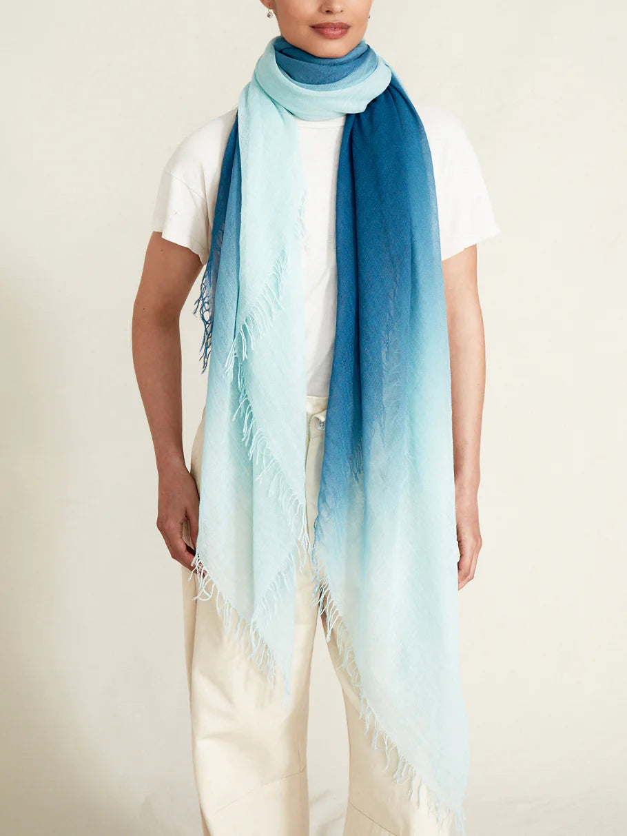 Dip-dye cashmere and silk scarf; ombre design transitioning from light teal to dark teal; fringed edges.