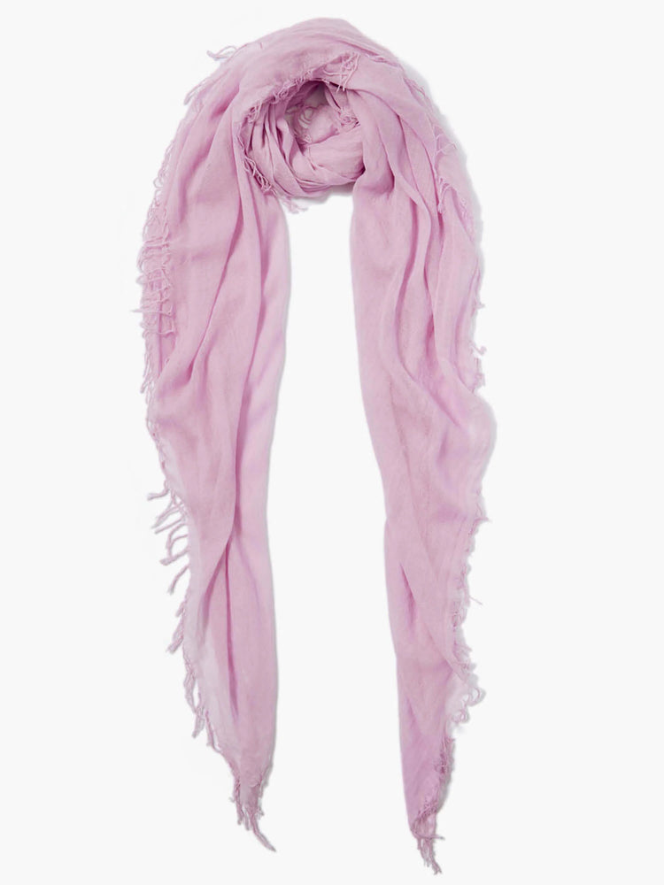 Light pink rectangular scarf with frayed edges. Folded loosely.