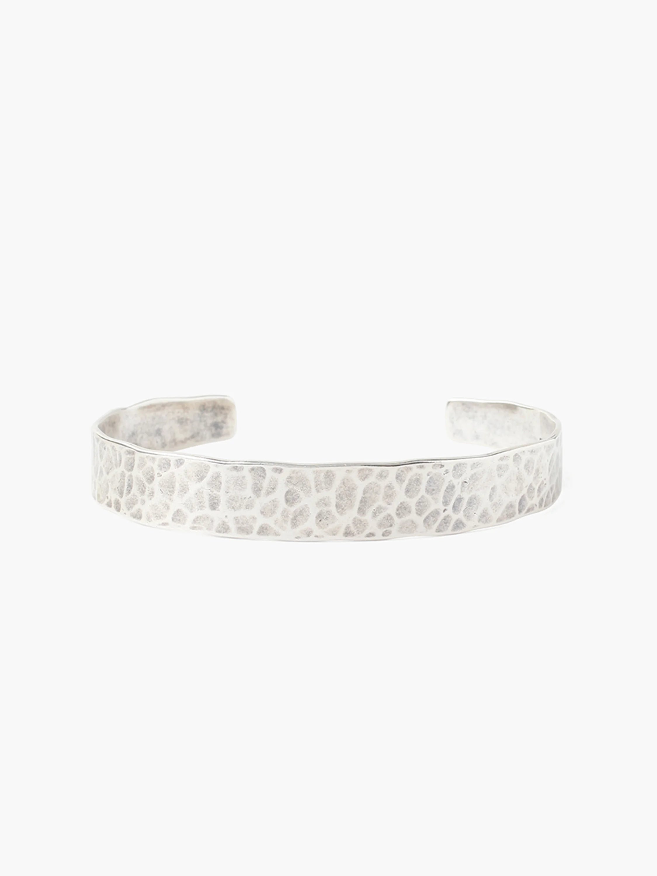 Silver hammered cuff bracelet; textured surface, slightly irregular shape.