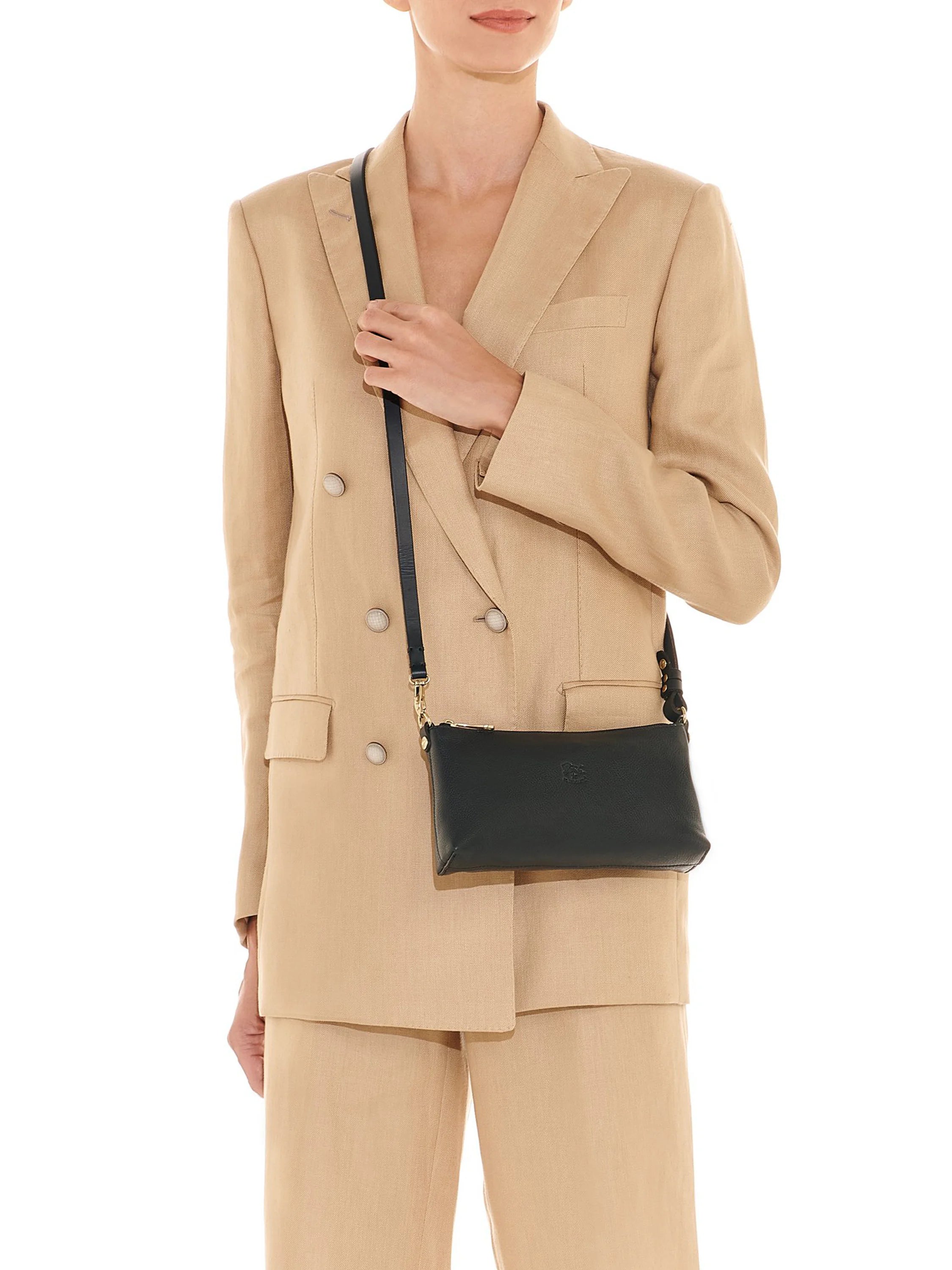 Dark green leather shoulder bag with a slim strap and gold hardware. Rectangular shape, worn crossbody.