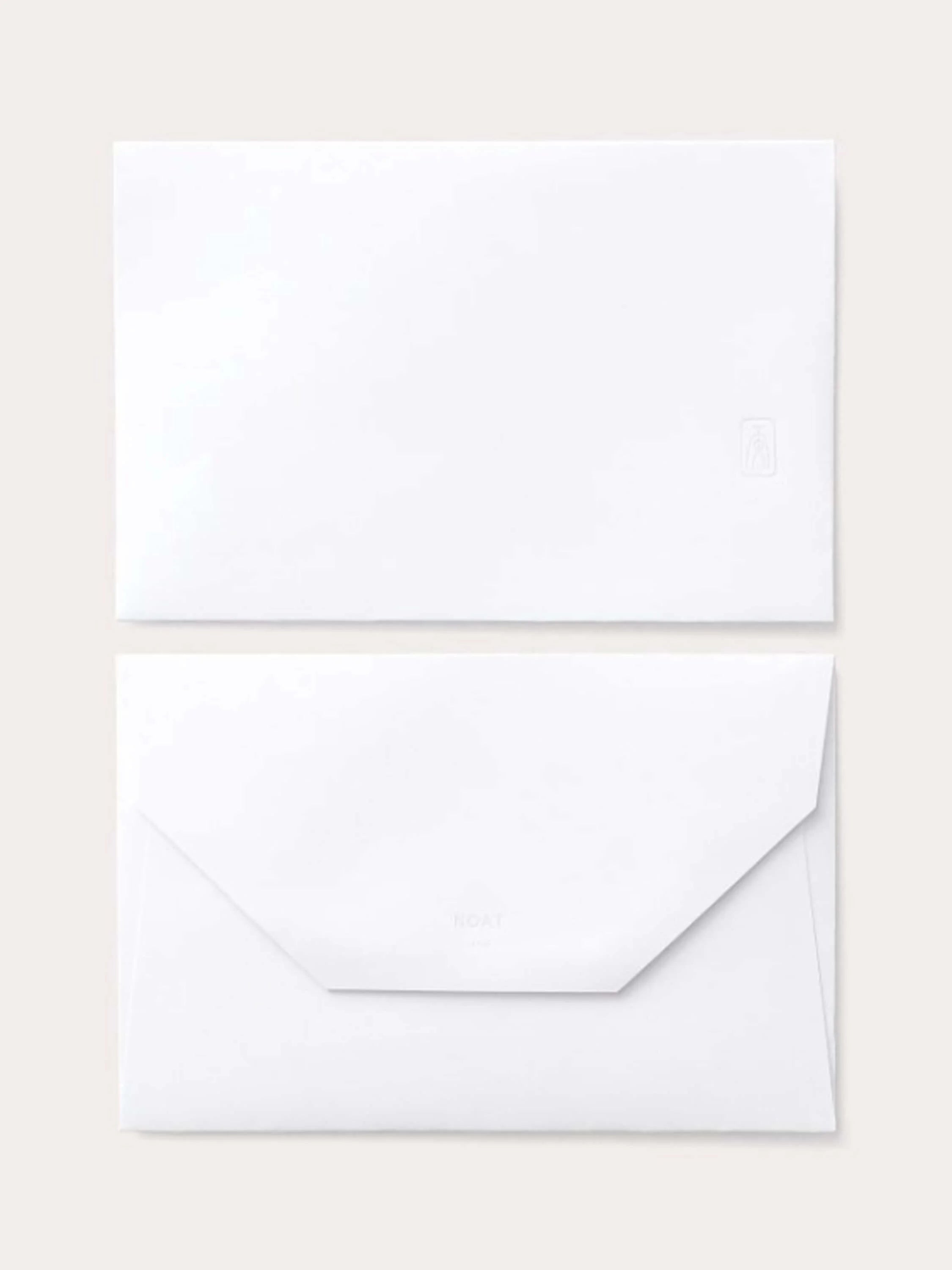 White card and envelope. Small, light gray logo on envelope. Subtle embossing.