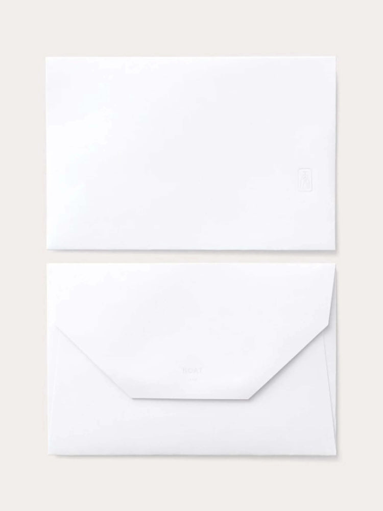 White card and envelope. Small, light gray logo on envelope. Subtle embossing.
