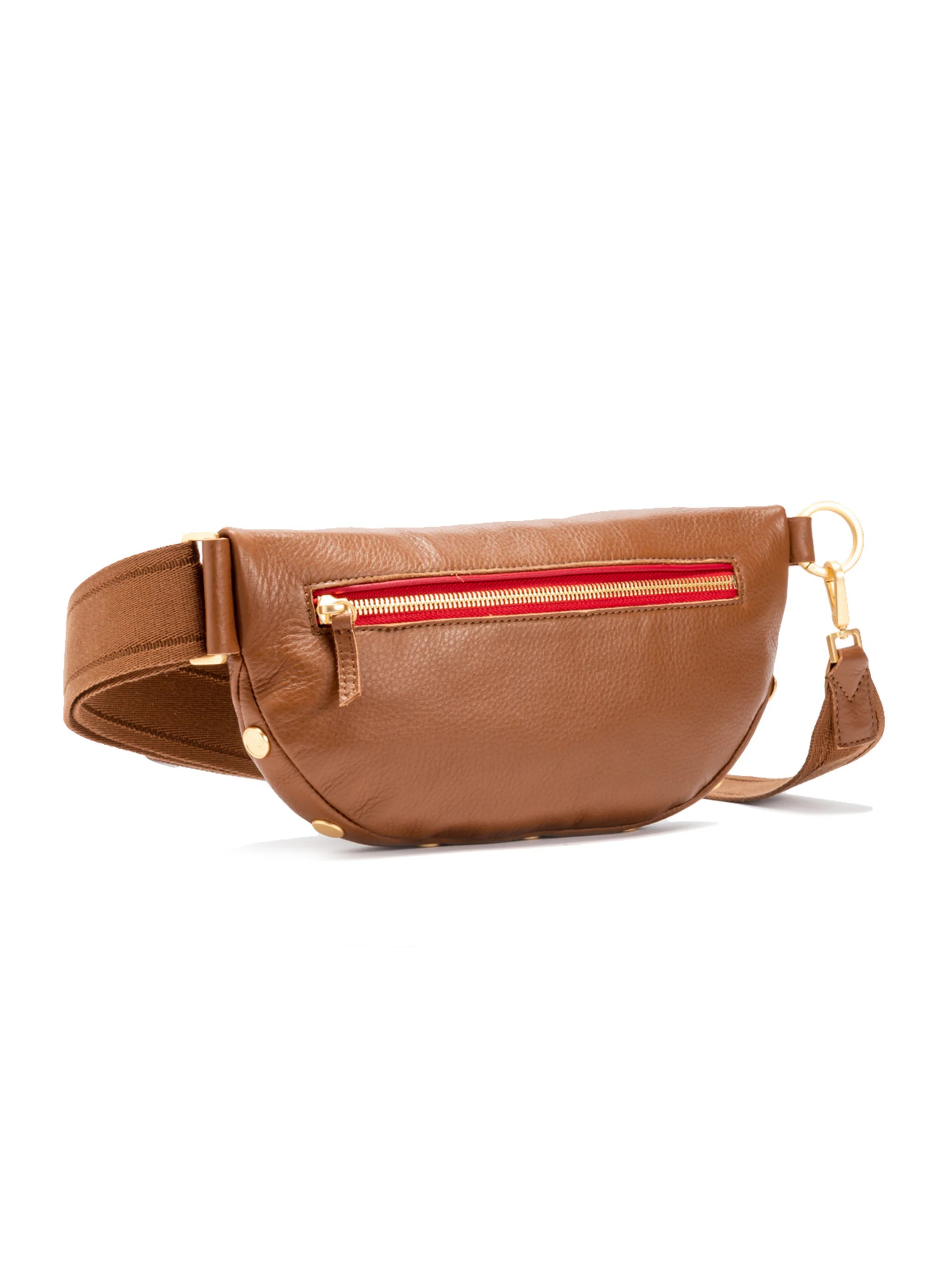 Brown leather crossbody, curved. Features a red-lined gold zipper, gold hardware, and brown strap.