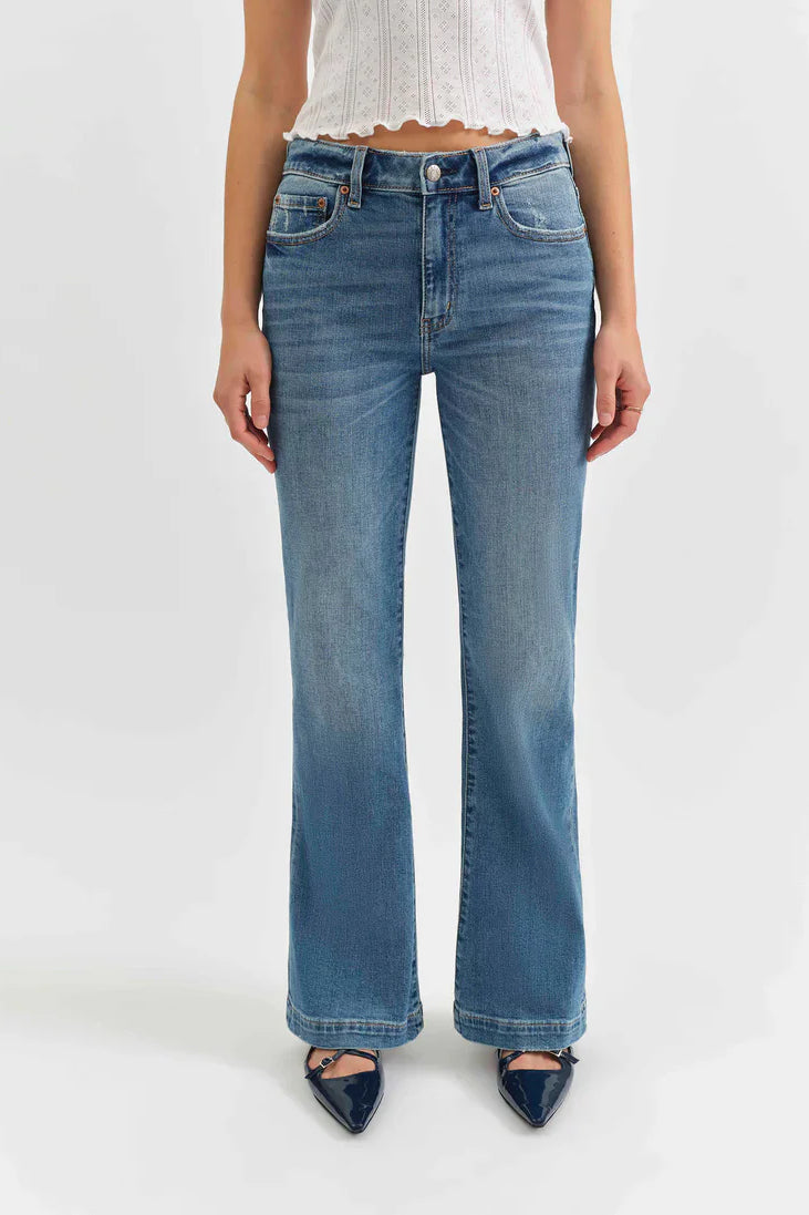 Medium blue mid-rise jeans, flared from the knee, with subtle fading on the thighs.