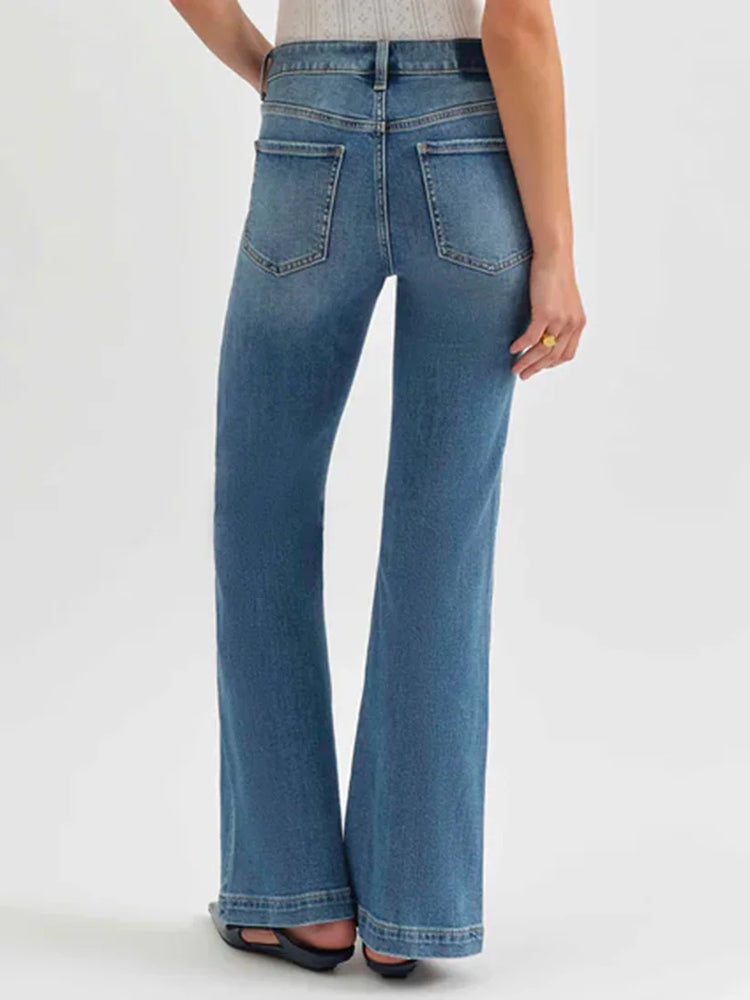 Medium blue wash mid-rise flare jeans with visible back pockets and subtle fading.