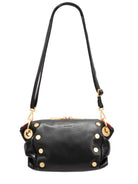 Black leather crossbody clutch with gold studs, red interior accents, and long black strap.