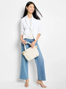 Off-white satchel with gold studs.  Medium size.