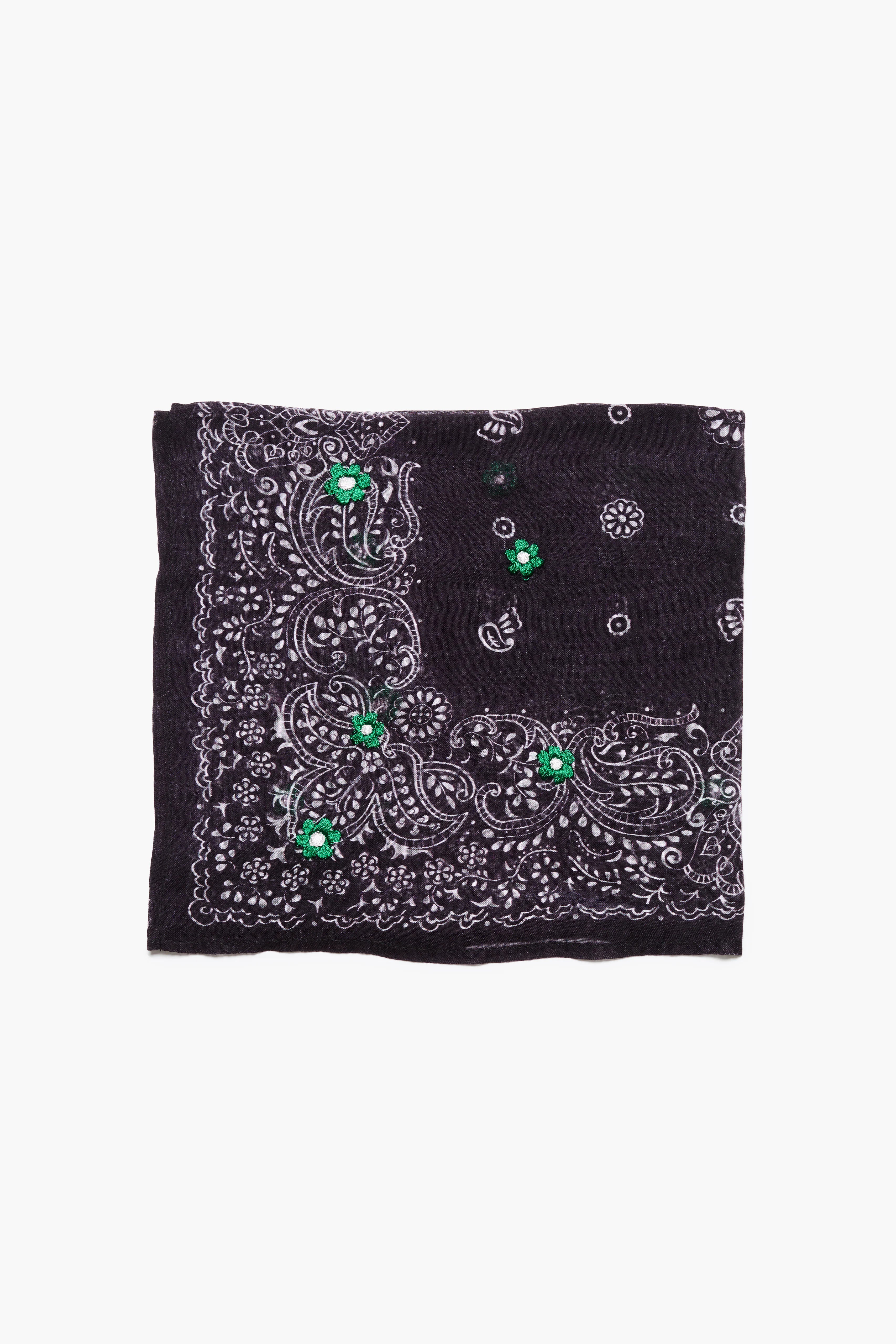 Dark bandana with white paisley pattern & green embroidered flowers.