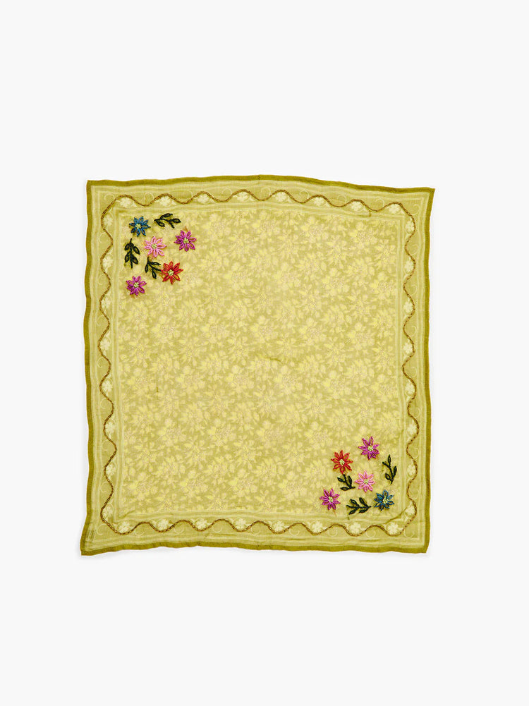 Lime green bandana with tonal floral lattice print, darker green border, wavy trim, and clusters of colorful embroidered...