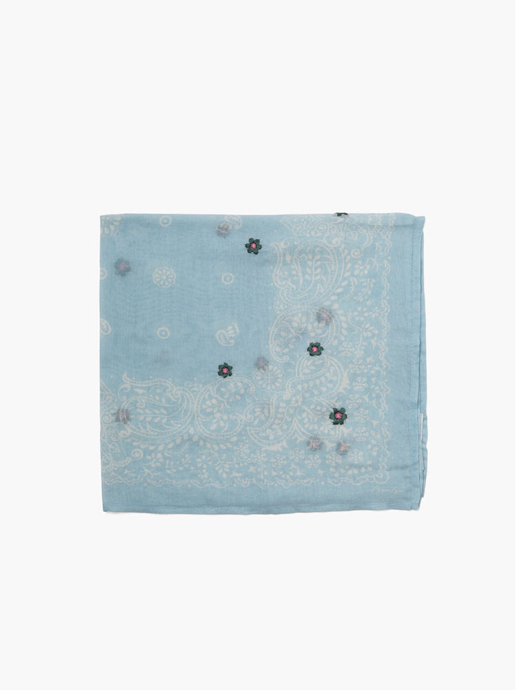 Light blue bandana with white paisley pattern and small embroidered flowers in pink and green.