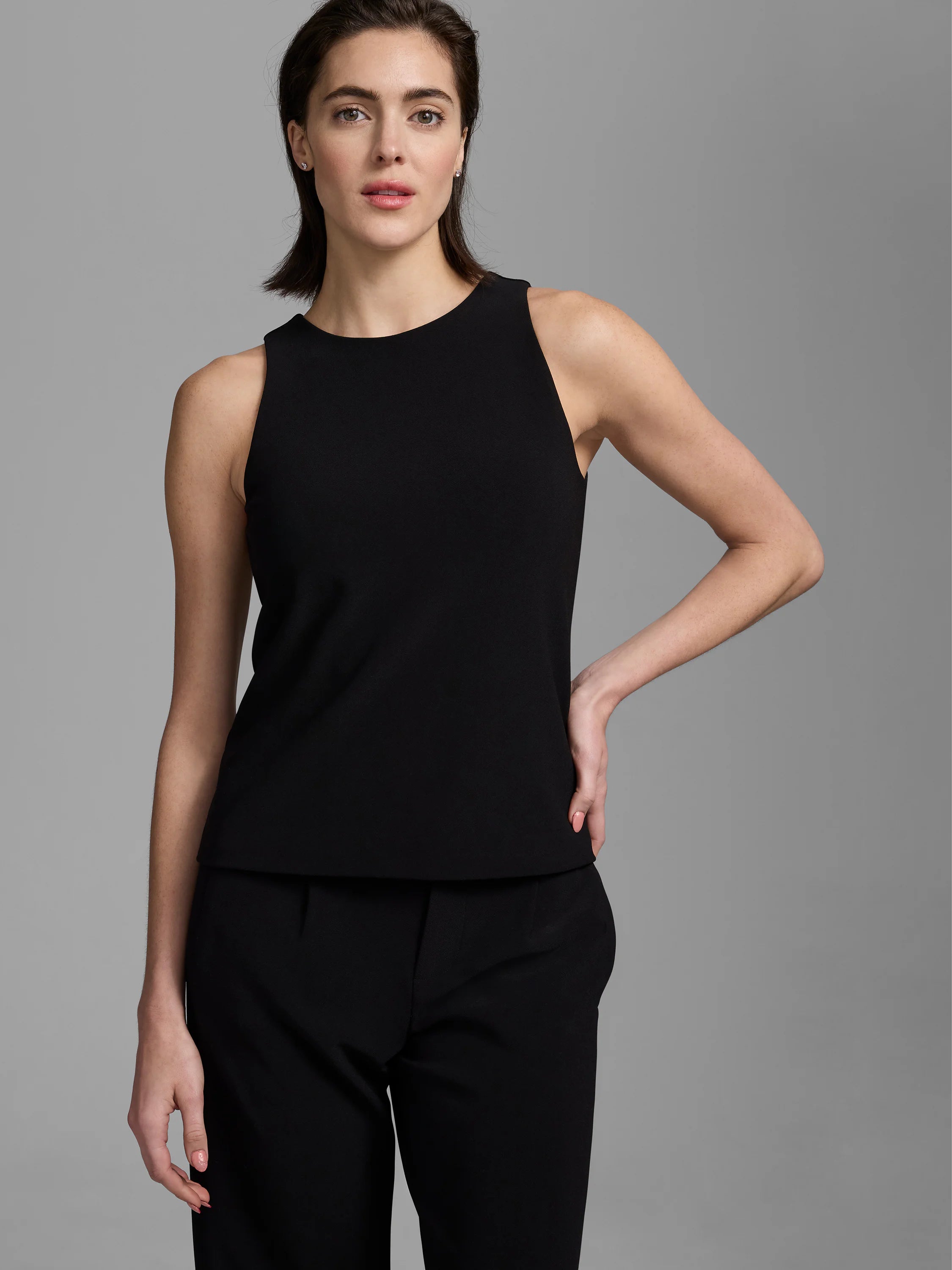 Black high-neck sleeveless tank with a smooth knit scuba texture.