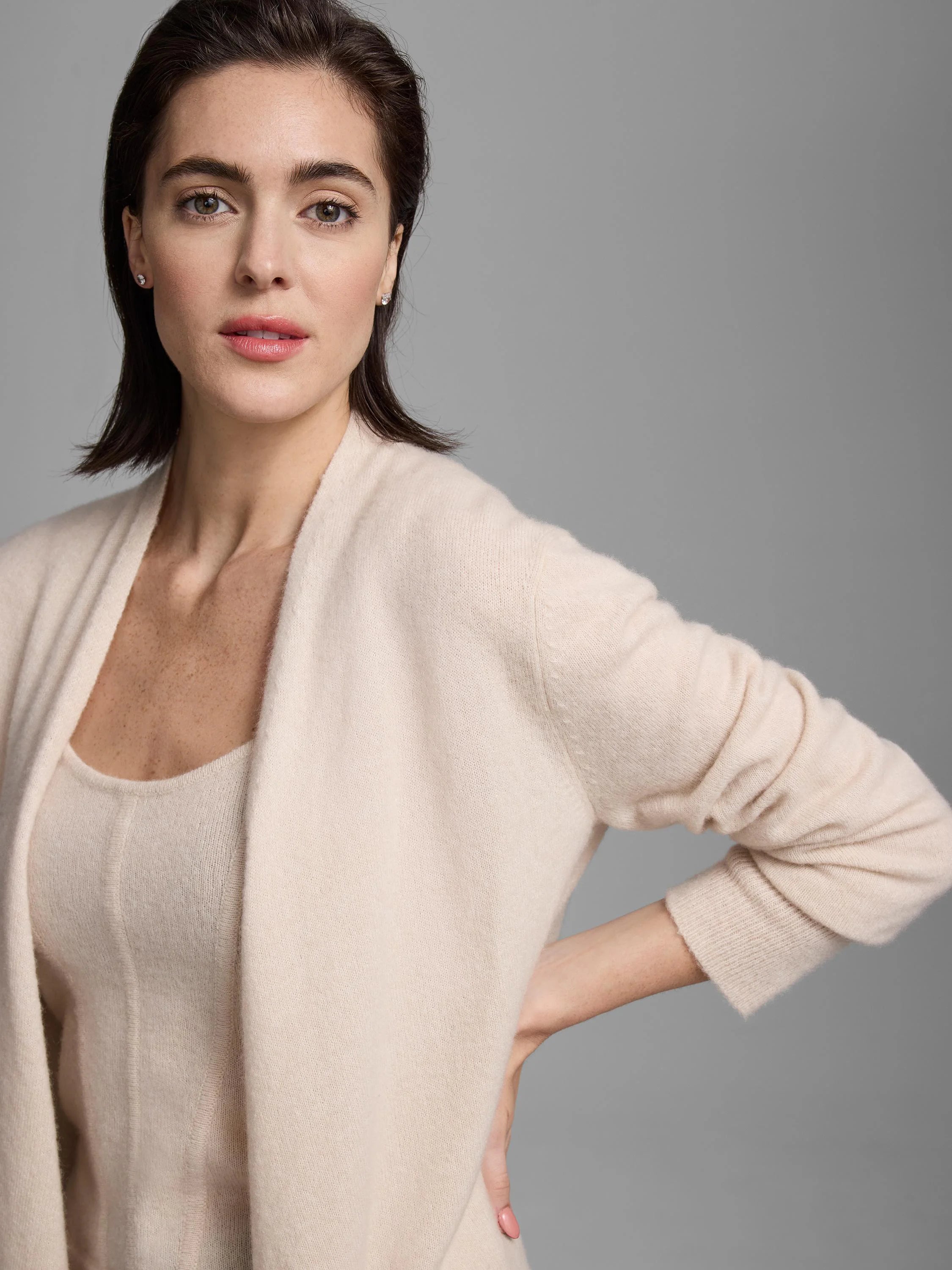 Light beige open-front cashmere cardigan with a soft knit texture.