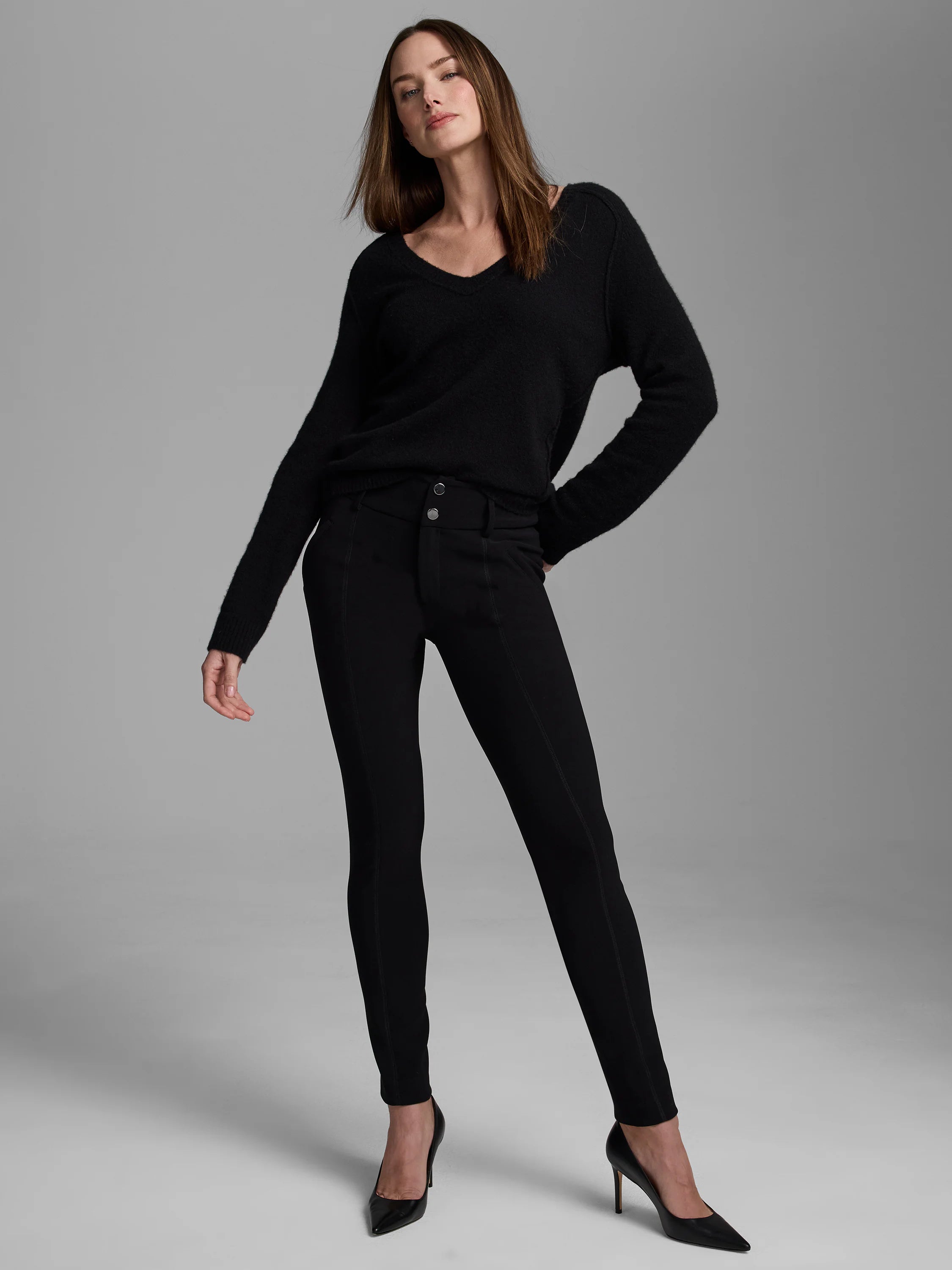 Black V-neck sweater, soft and fuzzy, with a relaxed fit, long sleeves, and ribbed cuffs.