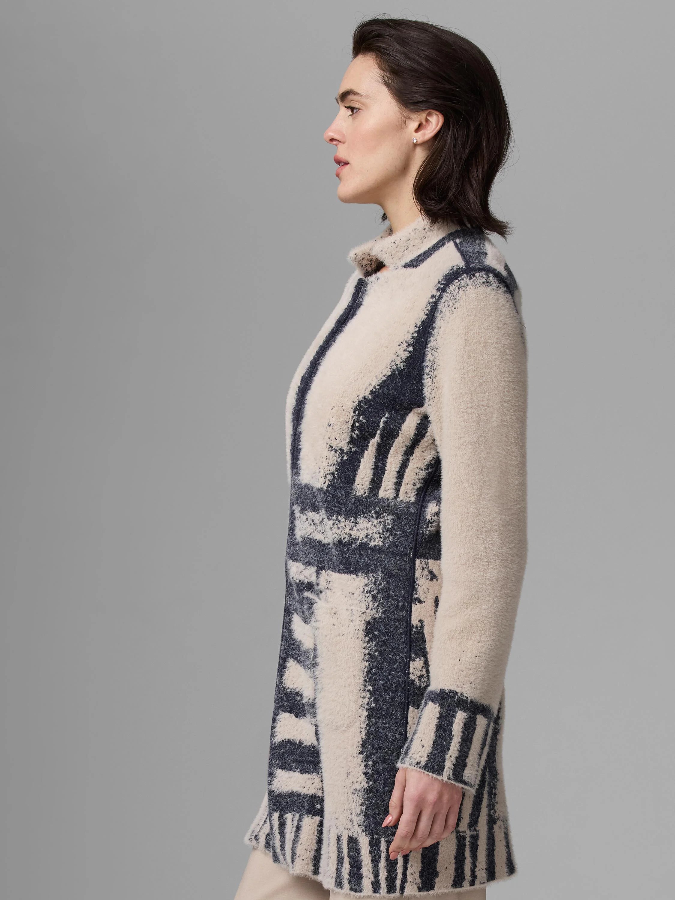 Textured cream knit jacket with an abstract pattern of irregular navy blue stripes and blocks.