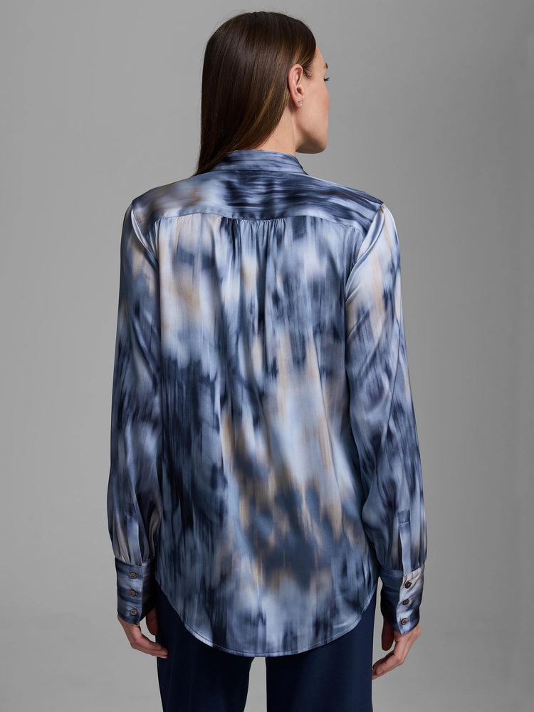 Blue and tan silk shirt with abstract vertical streaky pattern, long sleeves, buttoned cuffs, curved hem.
