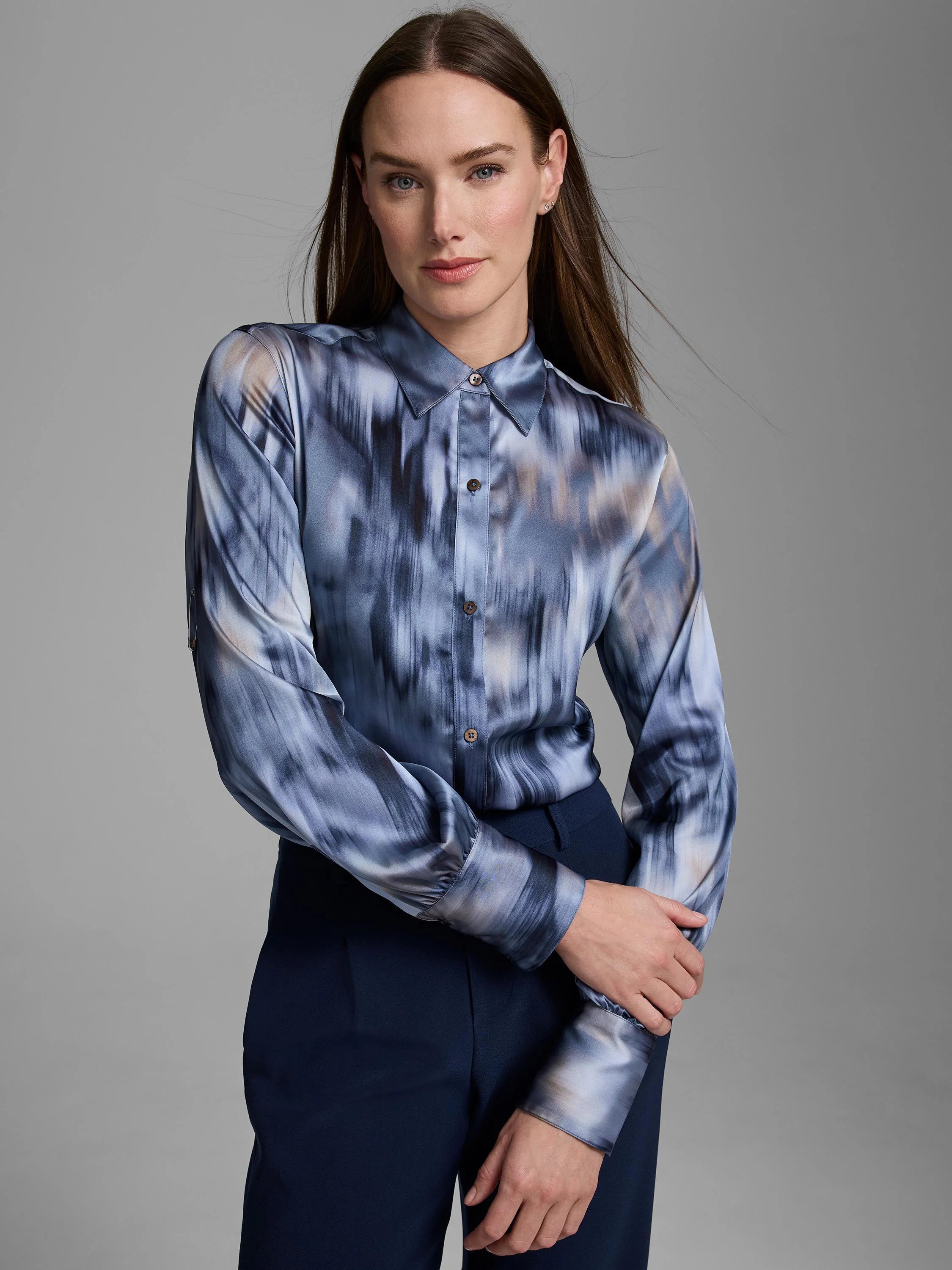 Silk shirt with blue, grey, and taupe vertical streaky pattern. Button-down, long sleeves, and collar.