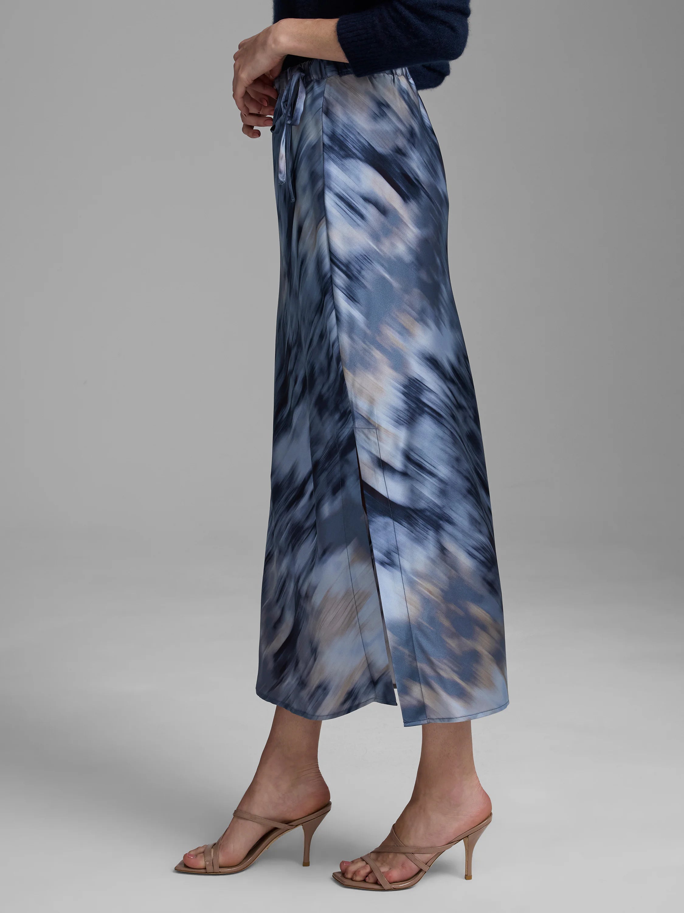 Blue and brown abstract silk slip skirt with a drawstring waist and high side slit.