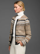 Beige knit jacket with black & white geometric woven patterns, black leather zipper trim, and fringe.