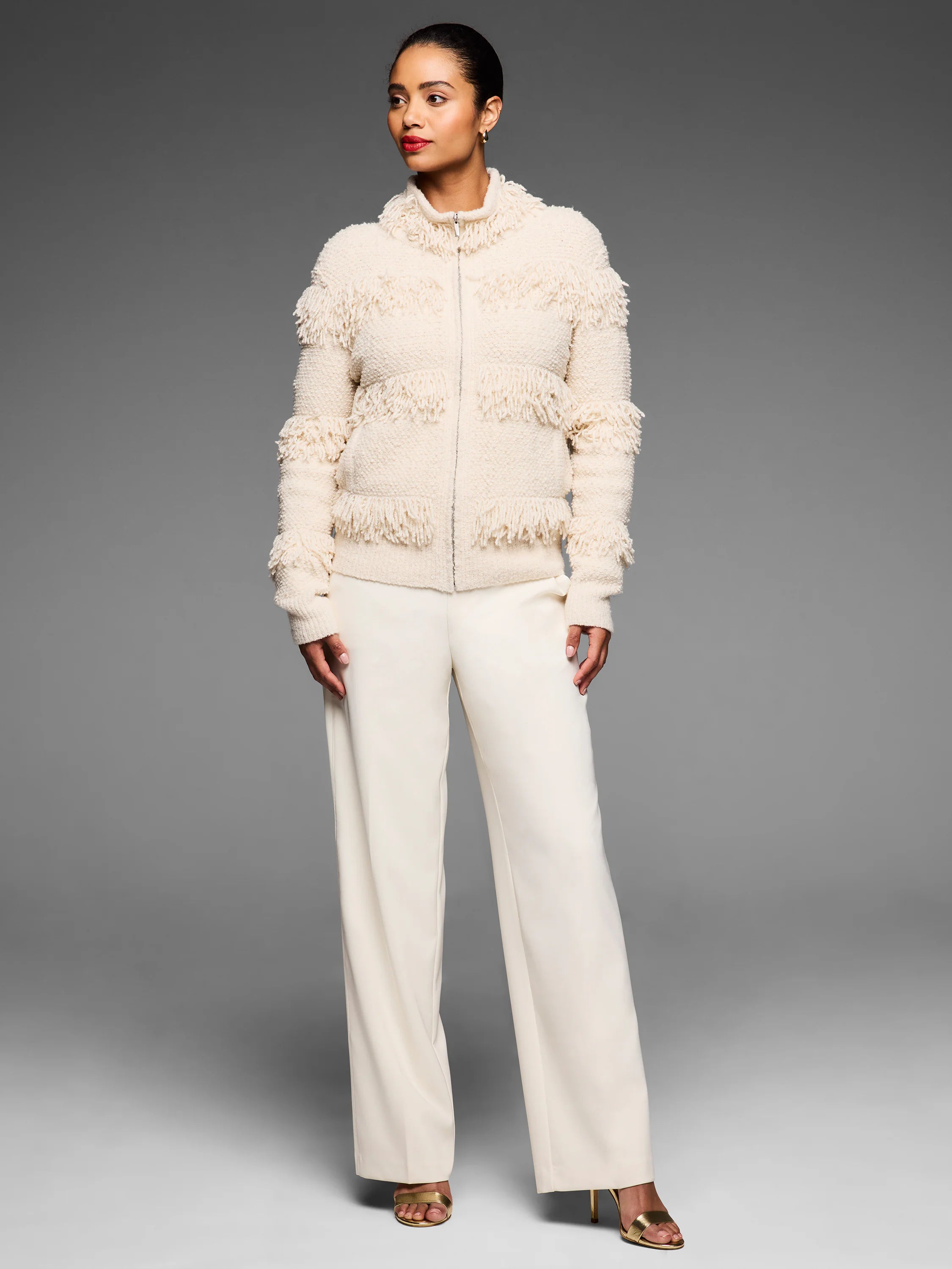 Cream zip-front jacket with dense, placed fringe rows on body & sleeves.