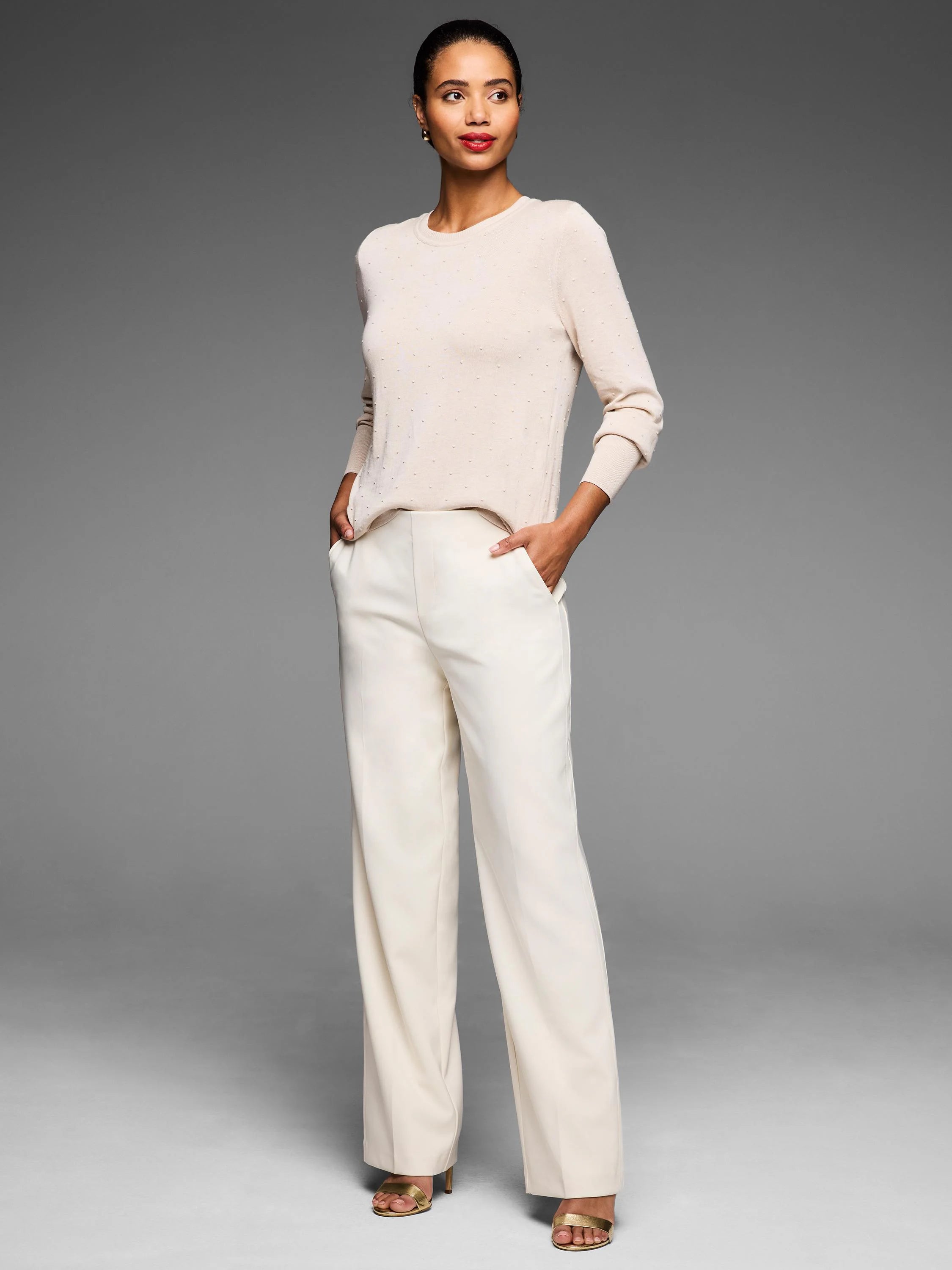 Light beige long-sleeve sweater with subtle dot texture.