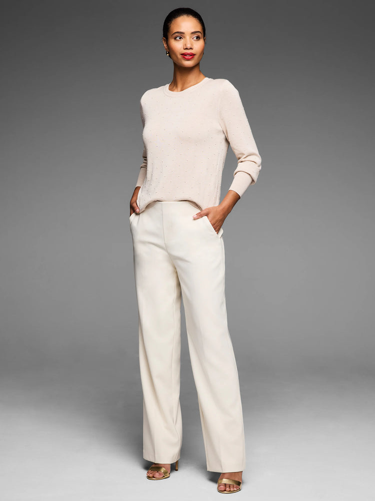 Cream long-sleeve crew neck sweater with raised dot texture.