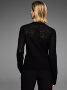 Black cashmere pointelle cardigan, shown from the back, features a delicate open knit texture.