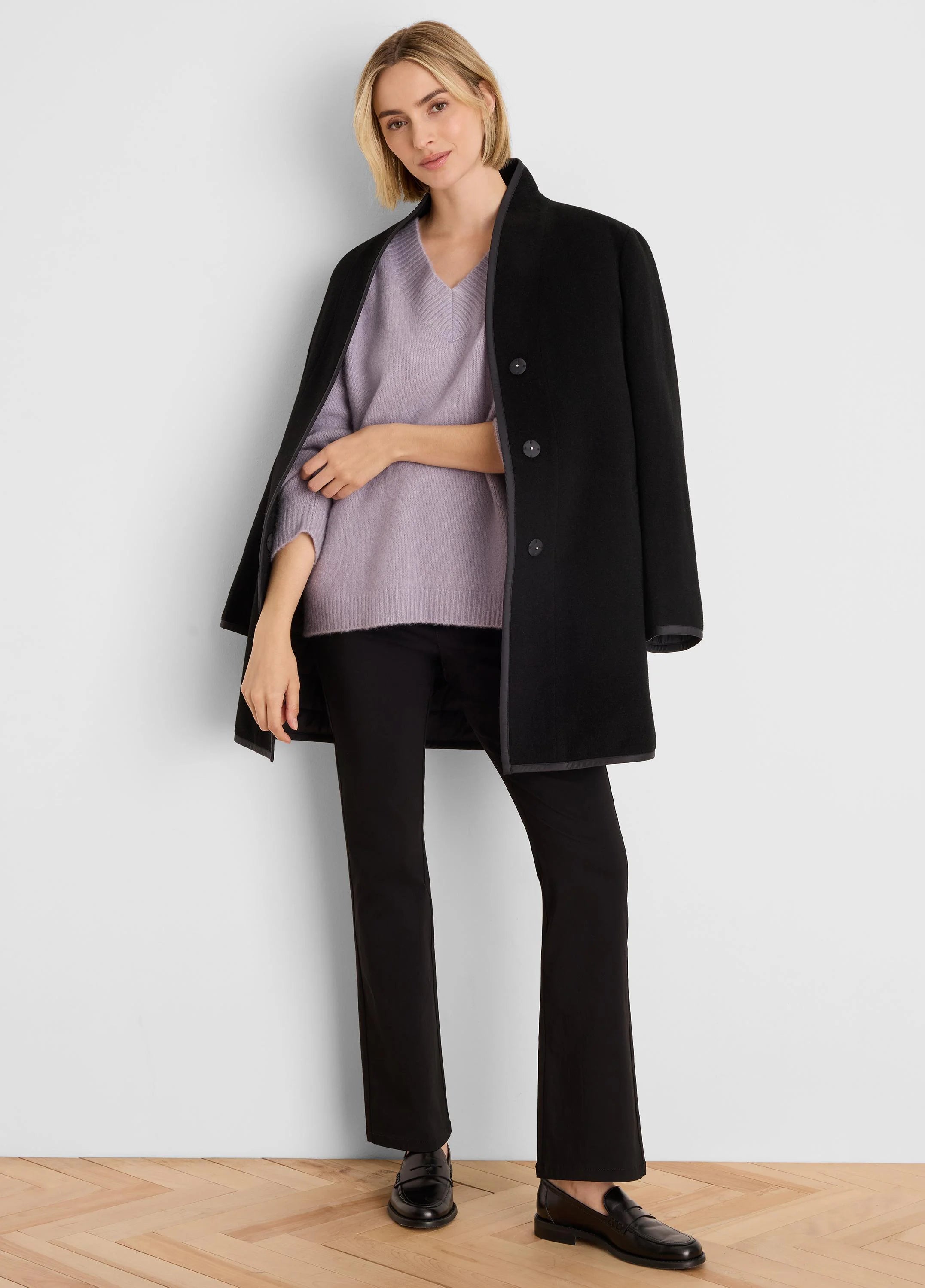 Light purple V-neck sweater with a fine knit texture.