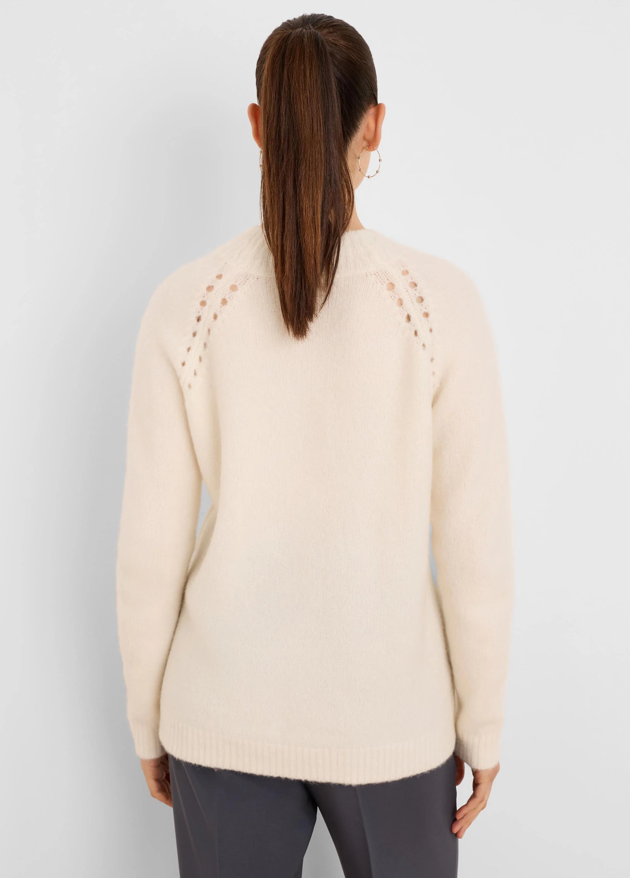 Off-white fuzzy sweater, shown from the back. Features a crew neck and delicate open-knit details along the shoulders.