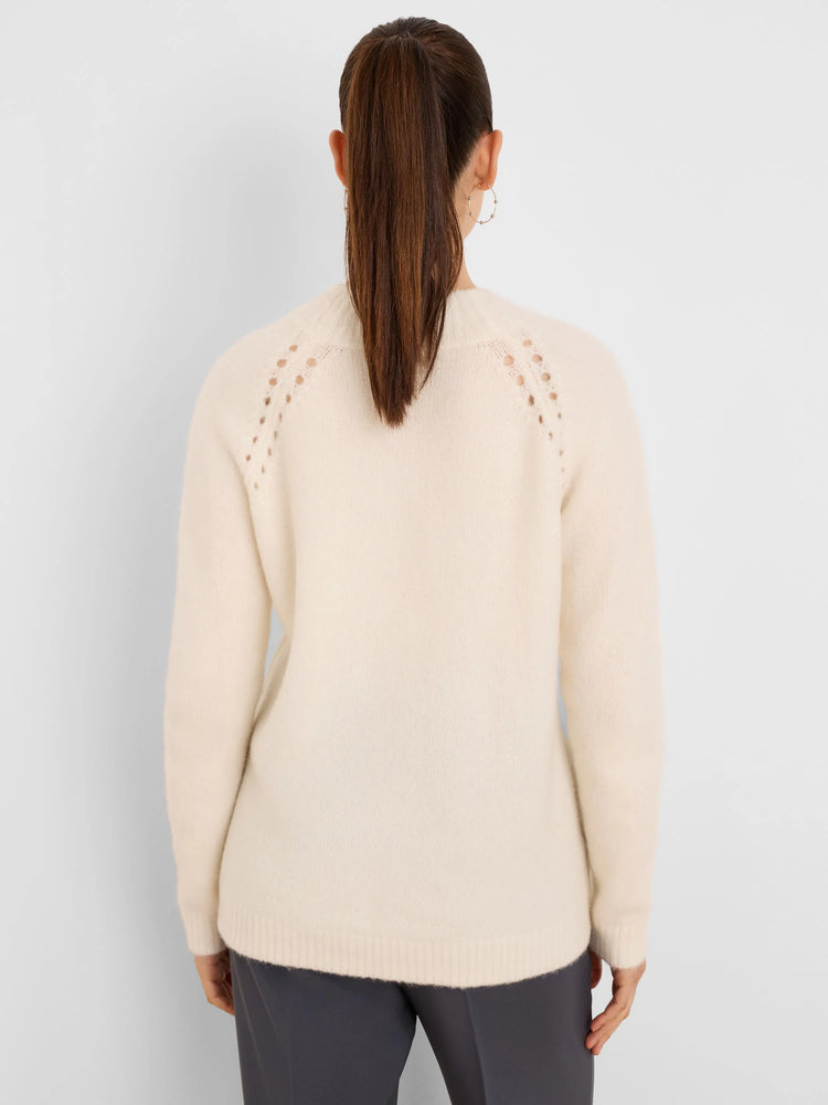 Off-white fuzzy sweater, shown from the back. Features a crew neck and delicate open-knit details along the shoulders.