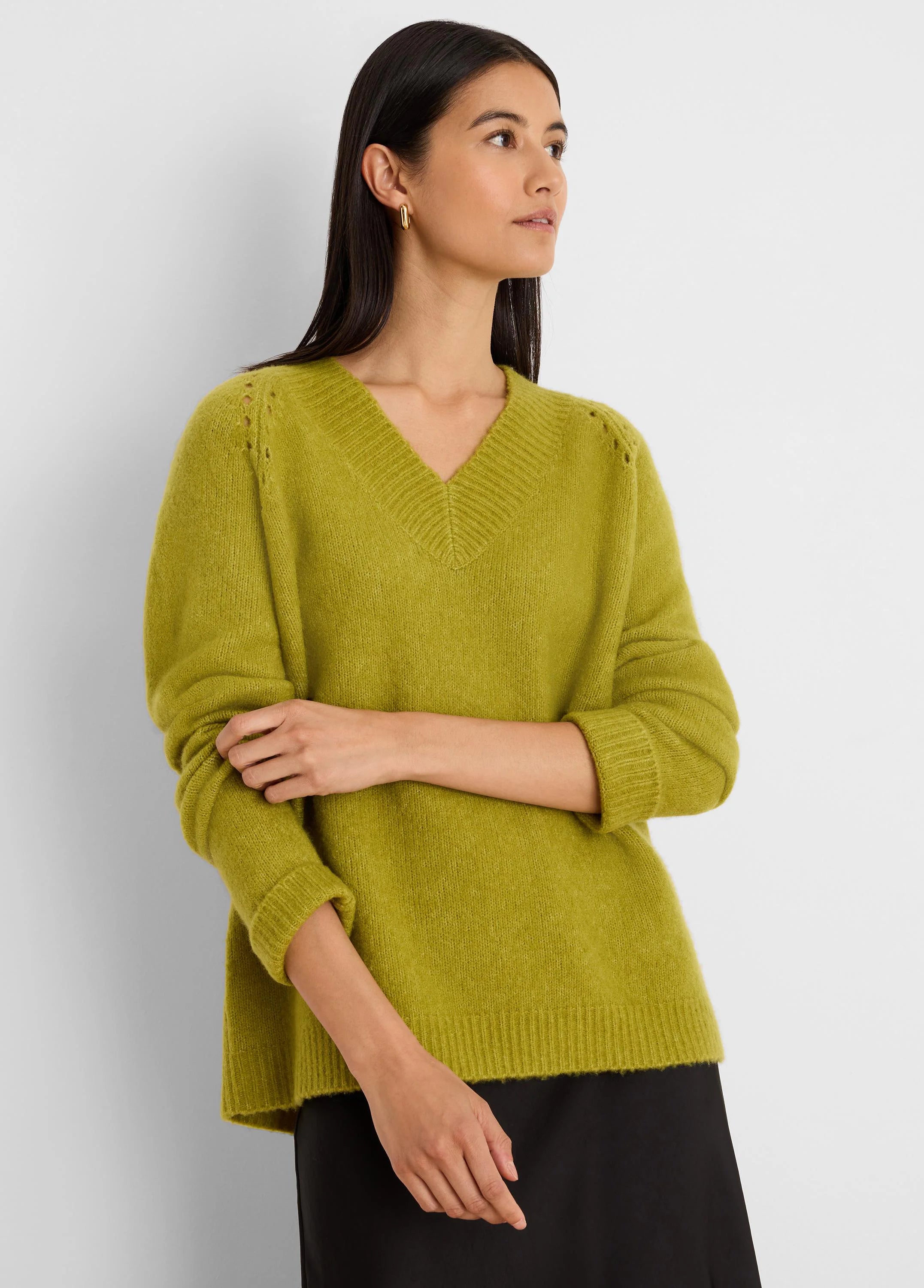 Lime green V-neck sweater with soft, fuzzy knit texture, ribbed cuffs/hem, and eyelet details on shoulders.