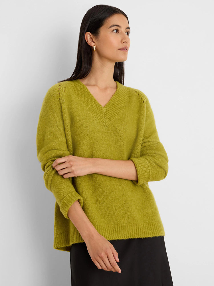 Lime green V-neck sweater with soft, fuzzy knit texture, ribbed cuffs/hem, and eyelet details on shoulders.