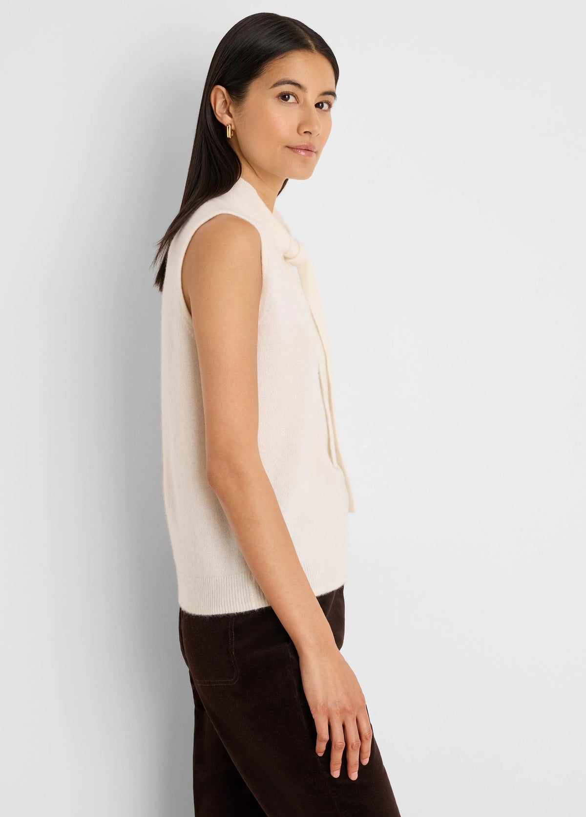 Cream cashmere blend sleeveless tank with a high neckline and bow ties.