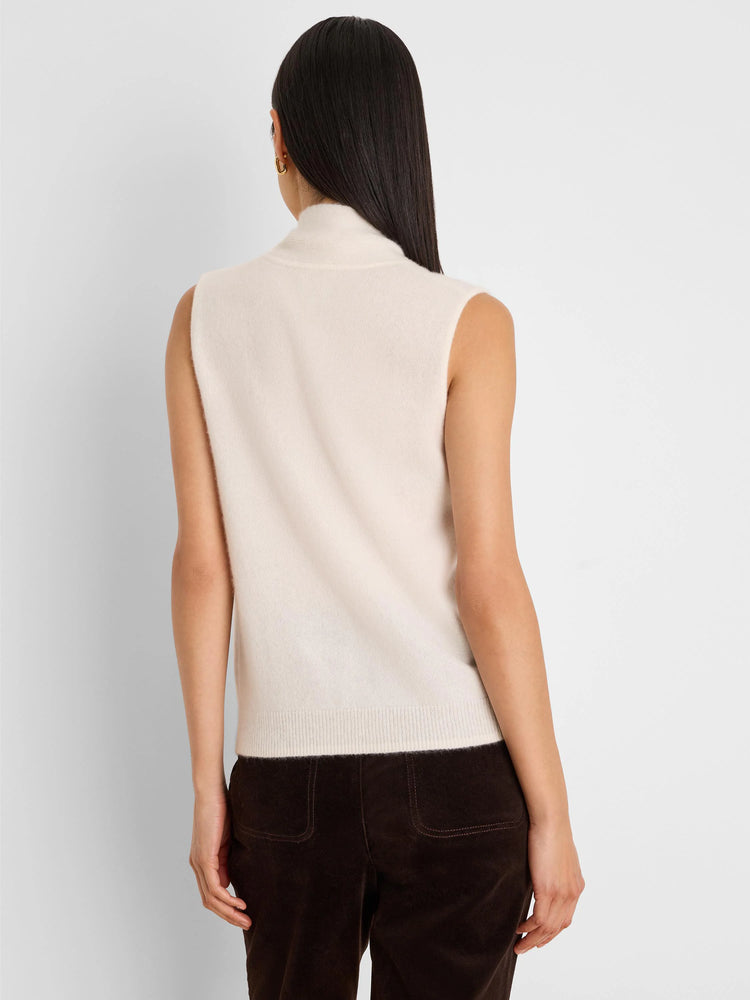 Cream sleeveless mock neck tank with ribbed hem, shown from the back. Soft, fuzzy texture.