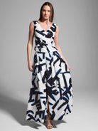 White sleeveless top and maxi skirt with a navy and black abstract print.  The skirt has a center slit.