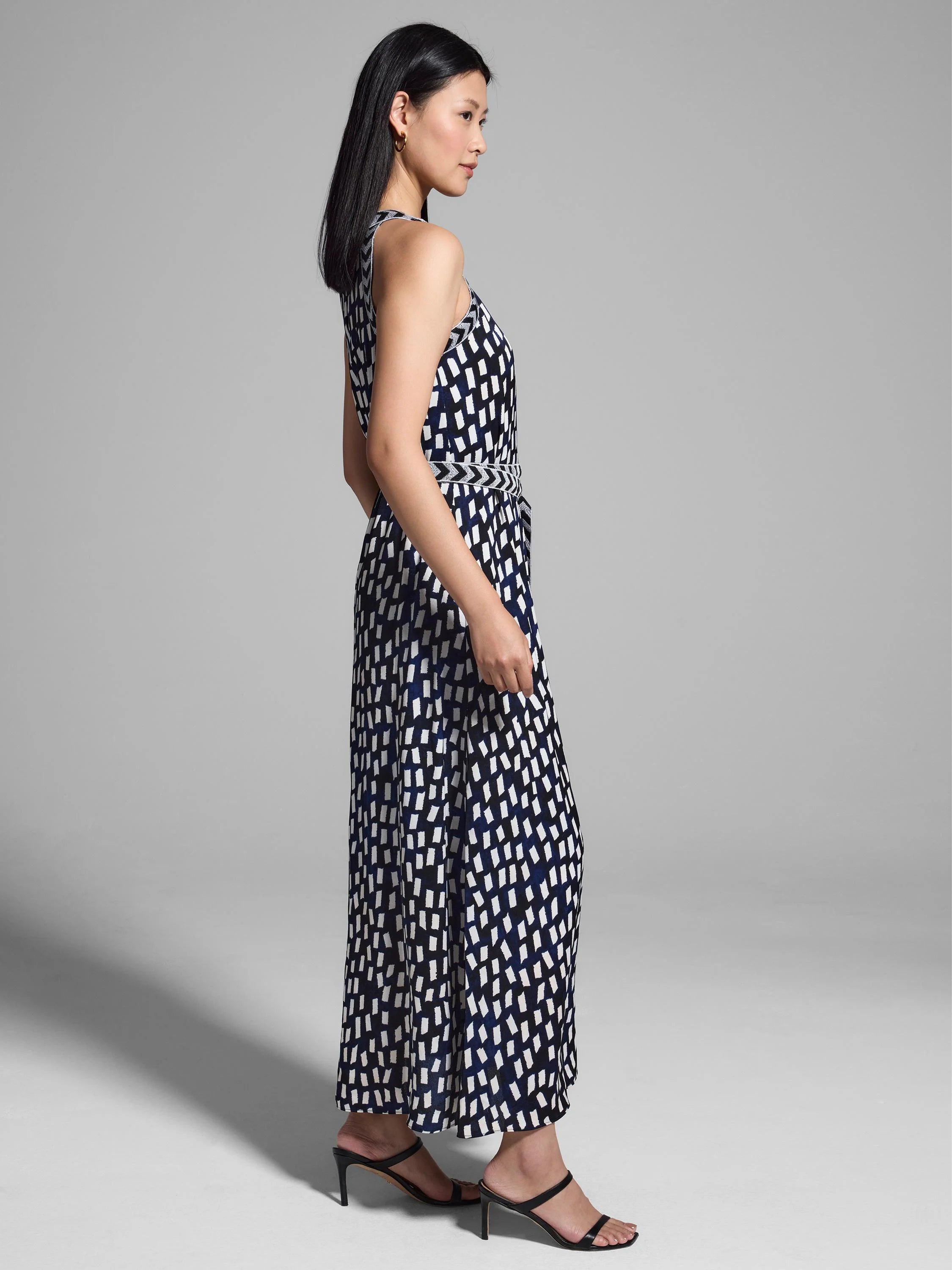 Black, white, and navy sleeveless maxi dress. Abstract rectangular print.  Belted waist.
