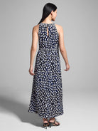 Black, white, and navy blue maxi dress.  Halter neck, keyhole back, and an abstract print.  Features a thin, patterned belt.