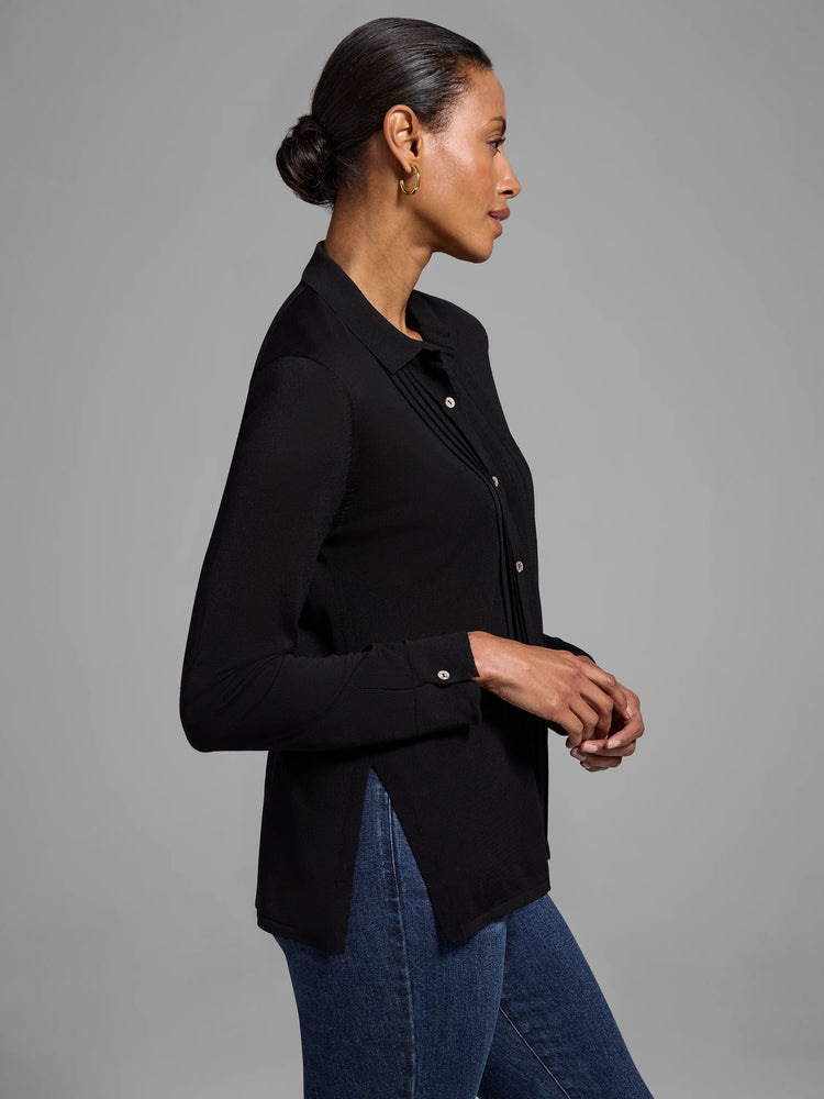 Black long-sleeve collared sweater with front pleats and side slits. The sweater is shown on a model.