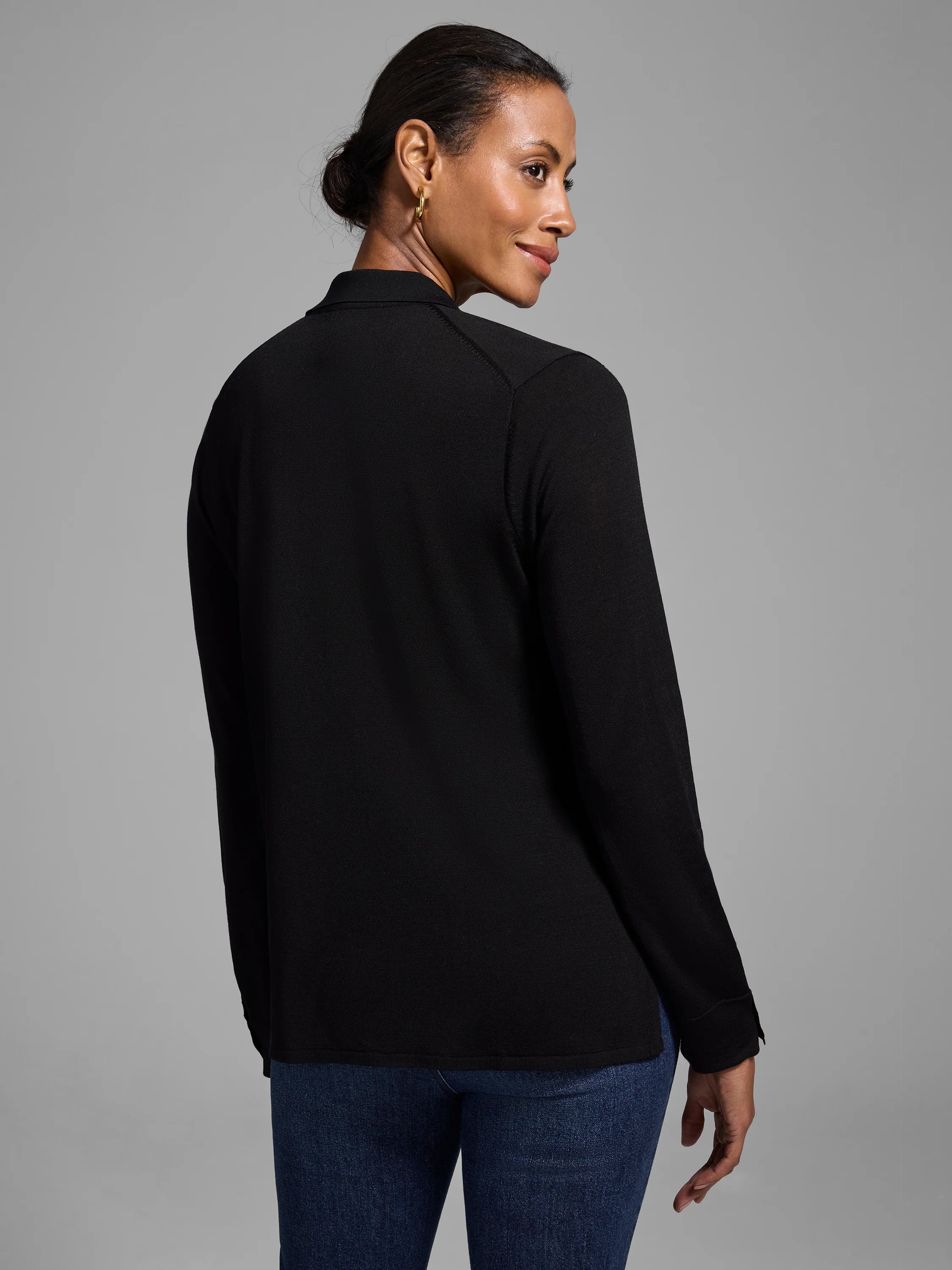 Black long-sleeved sweater, collared, drapey fabric.  Shown from the back.