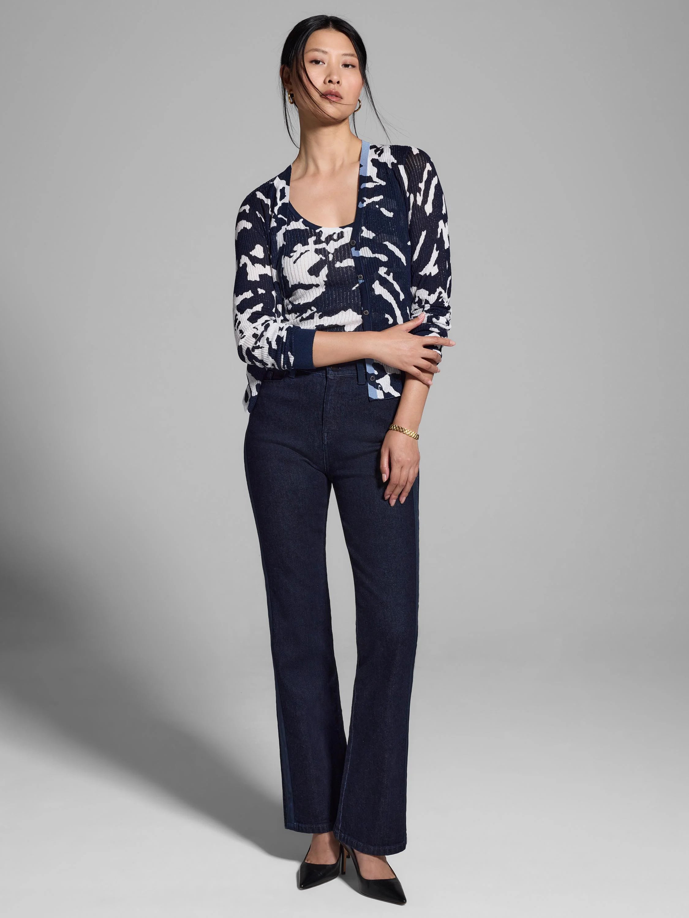 Dark navy blue and white abstract print cardigan.  Long sleeves, button front.