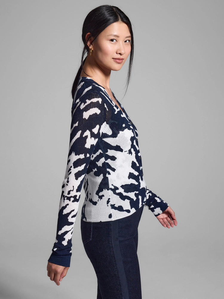 Navy blue and white abstract print long-sleeved cardigan. Button front.
