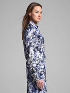 Silk shirt, long sleeves, collared.  Off-white background with navy blue floral print; scattered dots.