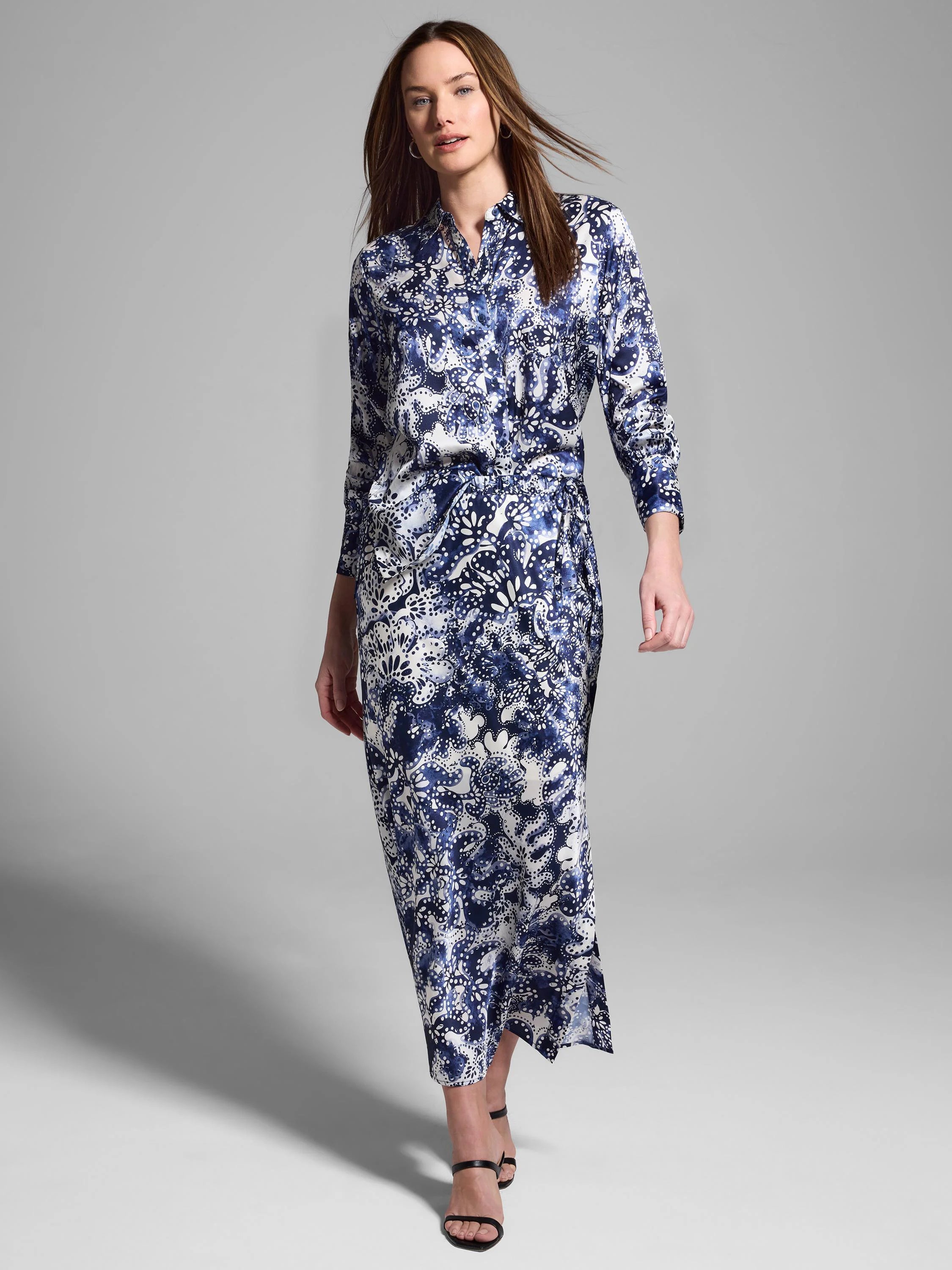 Long silk skirt in navy blue and white with a floral pattern.  Maxi length, side slit.