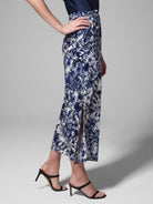 Midi silk skirt, navy blue and white floral print, center front slit.