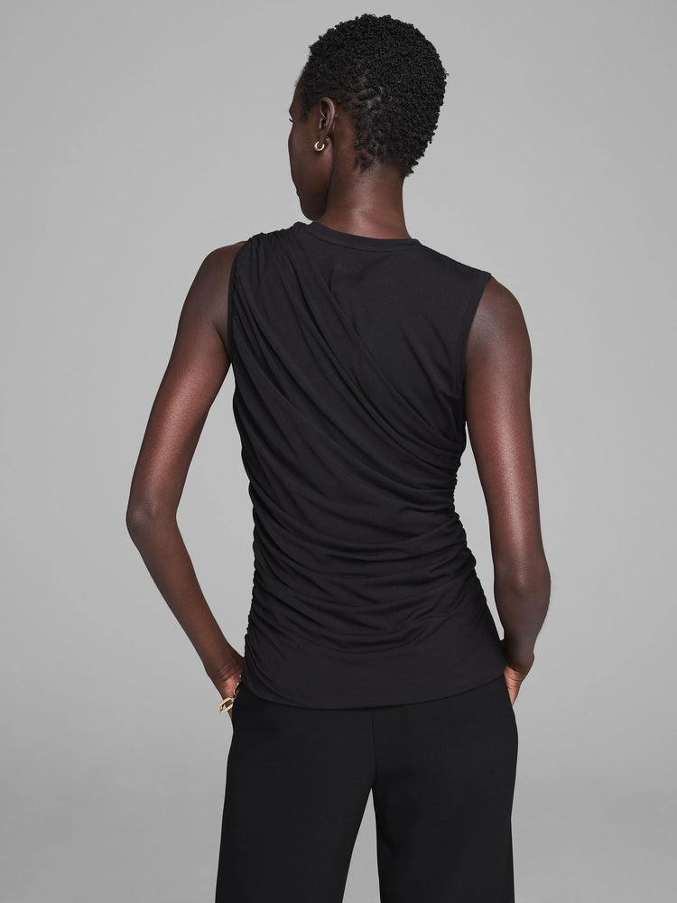Black jersey tank with prominent diagonal draping across the back. View from behind.