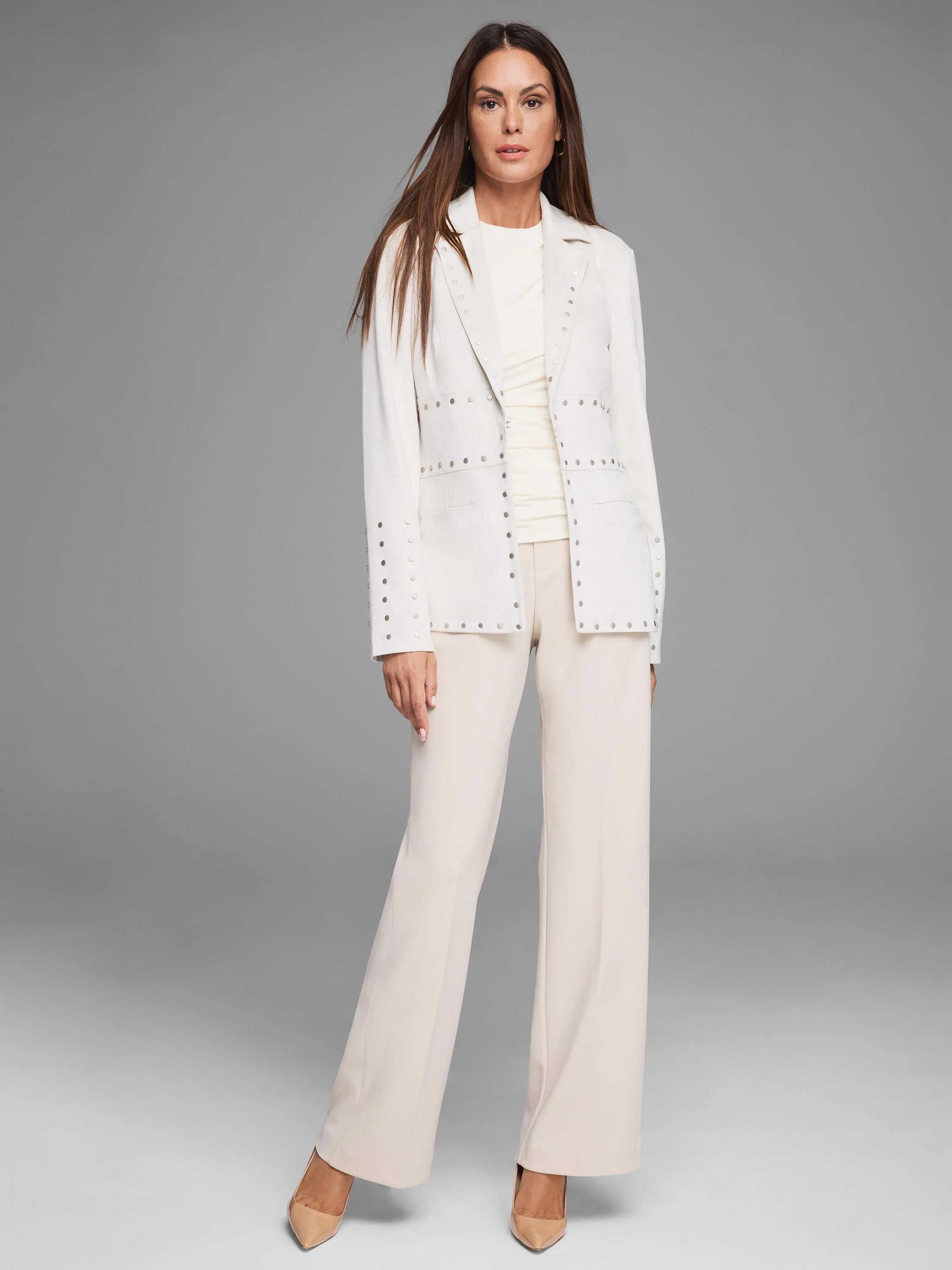 Off-white blazer with silver-toned studs along lapels, front opening, pockets, and cuffs.